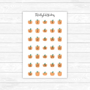 May include: A sheet of 31 pumpkin-shaped stickers with numbers 1 through 31. The stickers are orange with green stems and leaves. The text "Totally Fab Stickers" is at the top of the sheet.