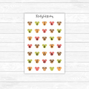 May include: A sheet of 31 stickers featuring a cartoon mouse head design in various colors. Each sticker has a number from 1 to 31 printed on it. The text "Totally Fab Stickers" is printed at the top of the sheet.