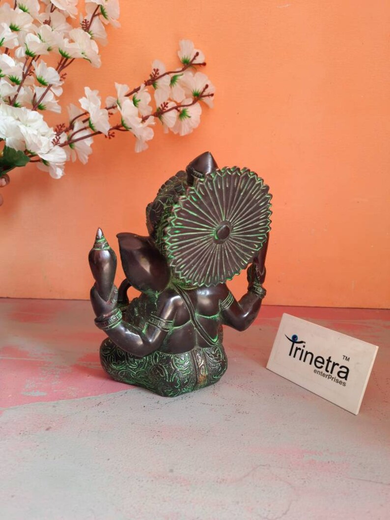 Trinetra superfine brass antique lord ganesh in sitting position totally handcasted.