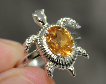 Tortoise ring shop with yellow sapphire