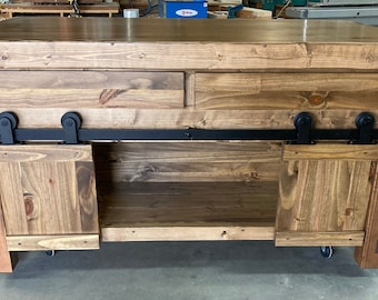 Kitchen island with seating, drawers and sliding doors