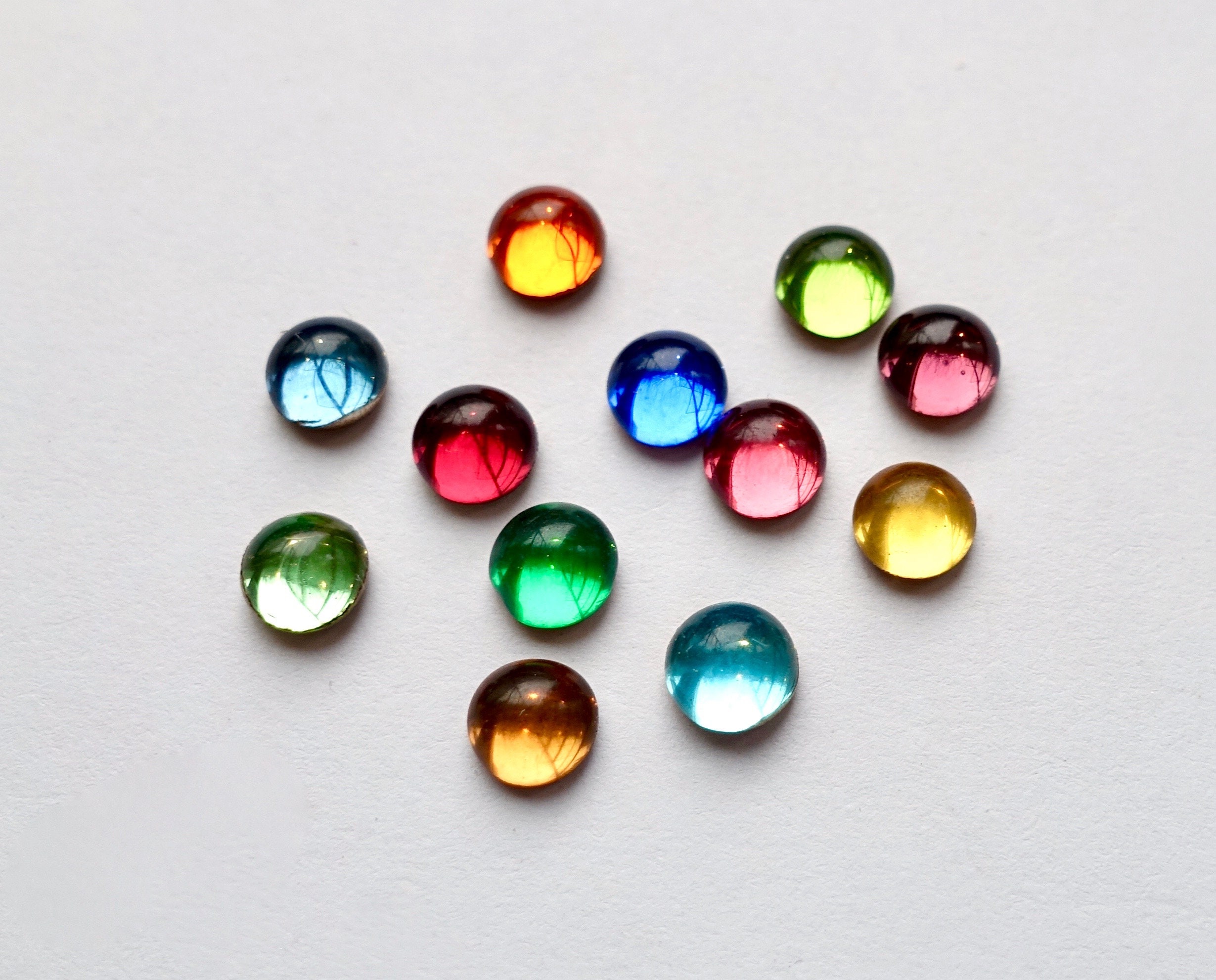 36 cabochons 5mm round foiled green blue orange red opal rhinestones originally made in Germany 1960s