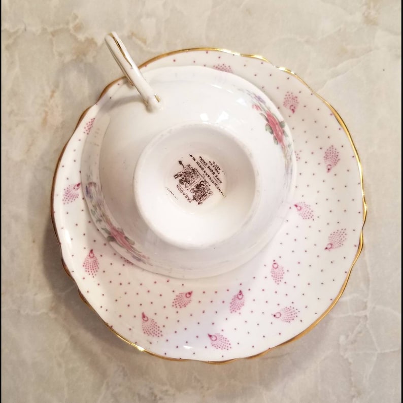Beautiful pink shabby chic Paragon polka dot teacup and saucer set with cabbage roses and feathers throughout Perfect gift!