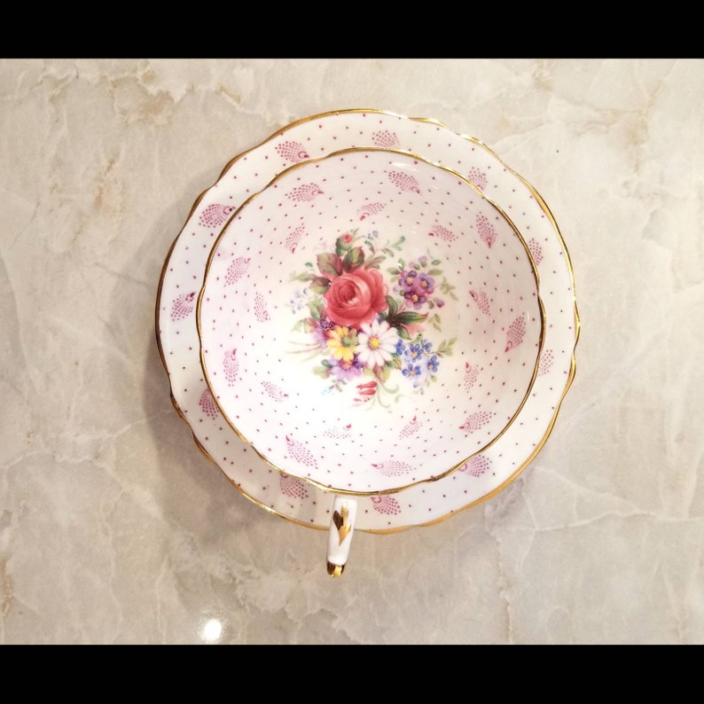 Beautiful pink shabby chic Paragon polka dot teacup and saucer set with cabbage roses and feathers throughout Perfect gift!