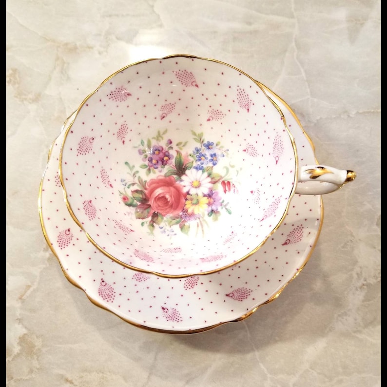 Beautiful pink shabby chic Paragon polka dot teacup and saucer set with cabbage roses and feathers throughout Perfect gift!