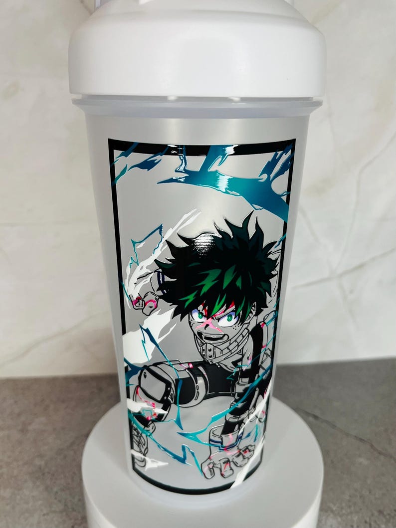 May include: White shaker bottle with a black and white graphic of a green-haired anime character with red eyes. The character is surrounded by white and blue lightning bolts.