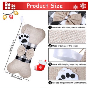 May include: A beige burlap dog bone stocking with a black and white checkered bow, a paw print applique, and a hanging loop. The stocking is 15.7 inches long and 7.8 inches wide.  Product Size is written at the top of the image.