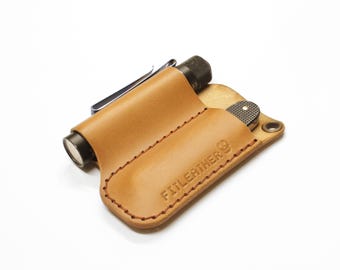 edc pocket organizer for small knife and flashlight.