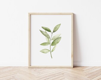 May include: A framed watercolor painting of a green leafy branch with a white background.
