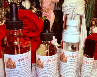 May include: Four bottles of Aphrodite oil and spray, including two glass dropper bottles, one spray bottle, and one roller bottle. Each container features a white label with the text Lucid And Wild Aphrodite, an illustration of a figure, and instructions.