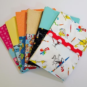 May include: A set of three ceramic mugs with a speckled, matte finish. The mugs are in shades of cream, light gray, and dark gray. Each mug has a simple, minimalist design, perfect for coffee or tea.