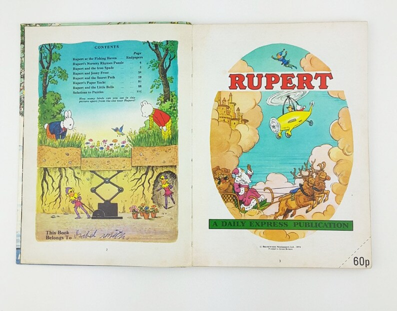 K&ouml;nnte beinhalten: Ein Vintage-Kinderbuchcover mit Rupert B&auml;r, einer Comicfigur, die in einem gelben Hubschrauber &uuml;ber einem Schloss fliegt. Das Cover tr&auml;gt den Titel "RUPERT" und enth&auml;lt den Text "A DAILY EXPRESS PUBLICATION" und "60p".