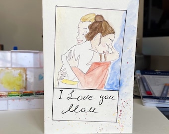 May include: A watercolor illustration of two people hugging. The person in the front is wearing a red shirt and the person in the back is wearing a white shirt. The text "I love you Mom" is written below the image.