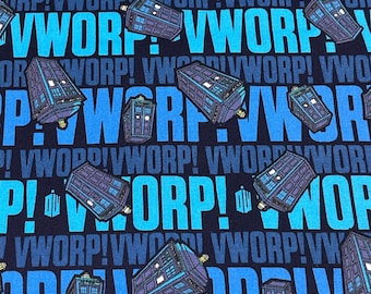 May include: A blue and black fabric with a repeating pattern of blue police boxes and the text "VWORP!" in a blue font.