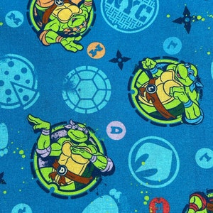 Tessuto di cotone Teenage Mutant Ninja Turtle TMNT NYC Icon Shape 2022 Viacom International Springs Creative Products Style CP 75102