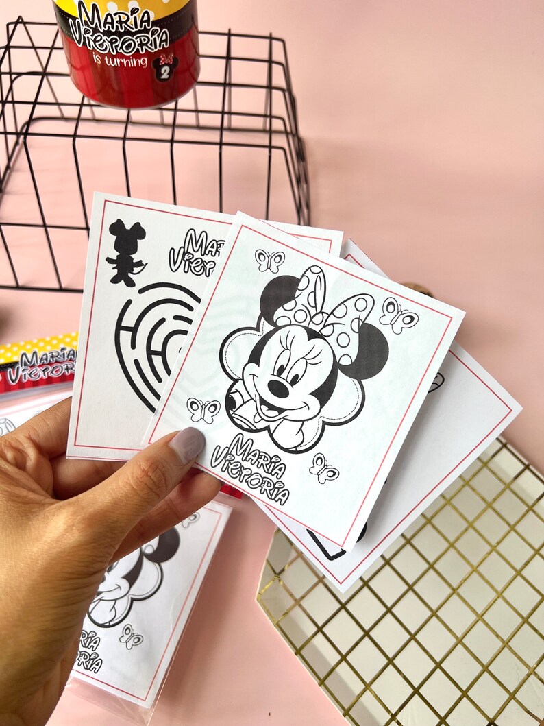 May include: Four black and white coloring pages featuring a cartoon mouse with a bow. The pages are labeled "Maria Victoria" and include butterflies.