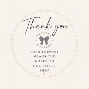 May include: A circular thank you card with a light beige background and thin border. It features the text Thank you, Nocturnal Monarch, and Your support means the world to our little shop. A black bow graphic is centered with a small heart icon.