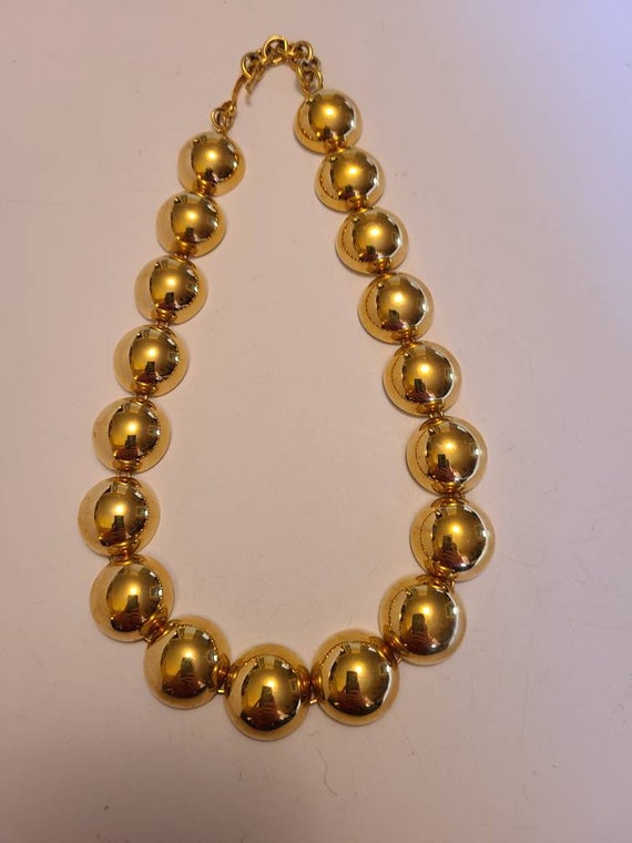 Monet signed half domed choker style necklace.