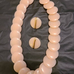 1970s Trafari peach colored lucite dics necklace and earring set. Like new condition.