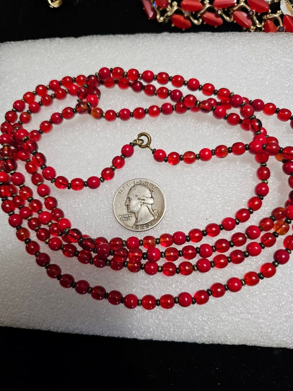 Red glass bead flapper style necklace. 54"