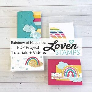 May include: Three rainbow-themed greeting cards with the text "Rainbow of Happiness PDF Project Tutorials + Videos" and "Loven STAMPS". The cards feature colorful rainbows, clouds, and the phrase "sending you a rainbow of happiness".