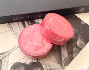 May include: Two circular rolls of bright pink washi tape featuring a grid pattern with small heart icons and the text MAP OF THE SOUL PERSONA printed in white. The tape rolls are wrapped in clear plastic and display a consistent design throughout.