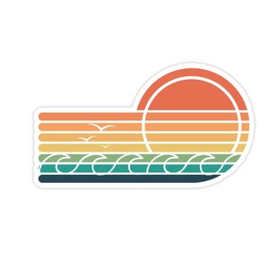 May include: A sticker featuring a retro sunset design. The design includes a vibrant orange sun, horizontal stripes in shades of orange, yellow, and green, and stylized waves. Three seagulls are flying above the waves. The sticker has a white border.