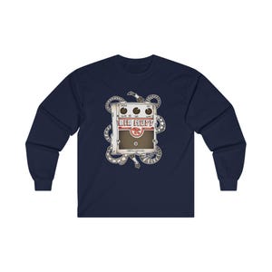 May include: A navy blue long-sleeve t-shirt with a graphic of a white Big Muff pedal with red text and a brown knob. The pedal is surrounded by a black and white snake design.