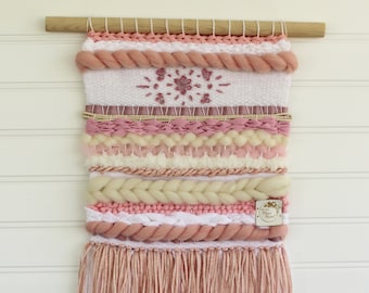 Pink woven wall hanging