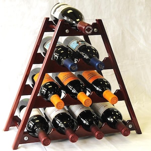 May include: A wooden wine rack with a triangular shape, holding 12 bottles of wine. The rack is made of dark wood and has a natural finish. The bottles are arranged in rows, with the top row being the most visible. The bottles are all different colors and have different labels.