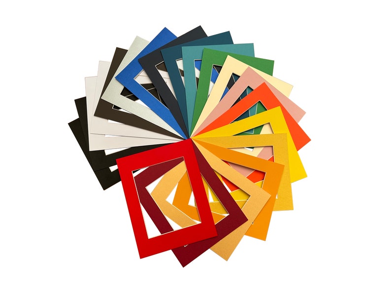 May include: A selection of coloured mount boards arranged in a circle, displaying various shades of red, orange, yellow, green, blue, and purple.