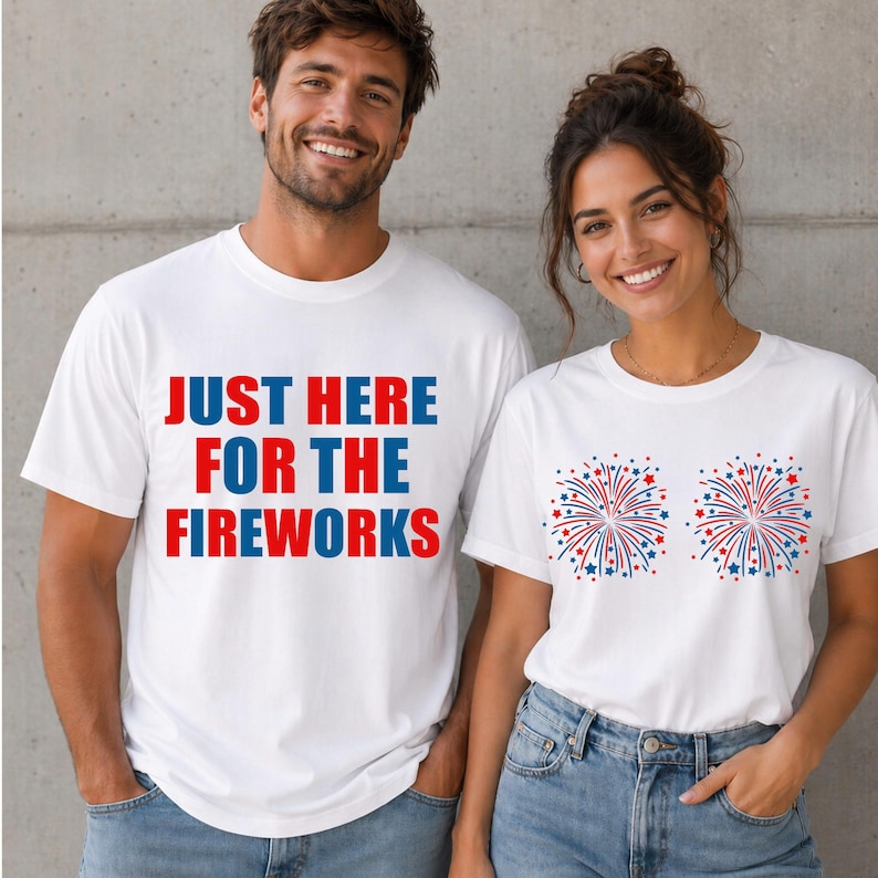 May include: Two people wearing white t-shirts. One shirt has the text "JUST HERE FOR THE FIREWORKS" in red and blue. The other shirt has two firework designs in red, white, and blue.
