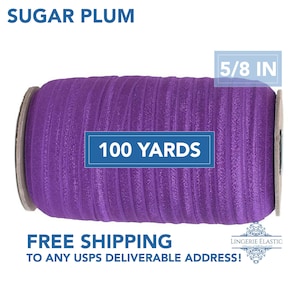 May include: A spool of purple elastic ribbon labeled "Sugar Plum." The ribbon is 5/8 inch wide and contains 100 yards. The product is designed for lingerie and other sewing projects.