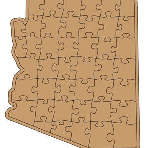 May include: A tan-colored jigsaw puzzle in the shape of the state of Arizona. The puzzle is made up of many interlocking pieces, each with a unique shape. The outline of the state is clearly defined.