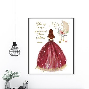 May include: A printable art print featuring a watercolor illustration of a girl in a red dress with gold glitter and stars. The text "She is more precious than rubies" is written in gold lettering above the girl. The background is white.