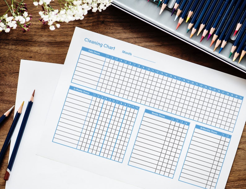 May include: A printable cleaning chart with sections for daily, bi-weekly, weekly, and bi-monthly chores. The chart is divided into a grid with numbered days of the month.
