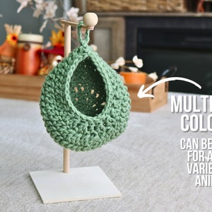 May include: A green crocheted hanging pet bed with a wooden stand. Get multiple colors! Can be used for a wide variety of animals!