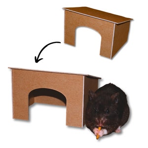 May include: A brown cardboard hamster house with a rounded archway entrance. The house is shown assembled and disassembled. A black hamster is eating a treat in front of the house.