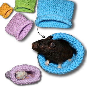 May include: Five crocheted hamster beds in different colors: orange, green, purple, light blue, and dark blue. Two hamsters are inside the beds.