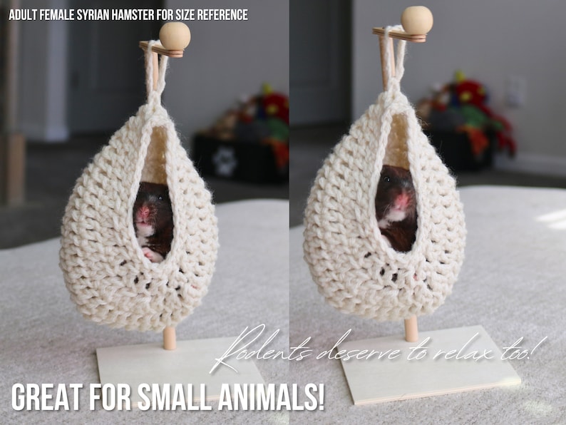 May include: A white crocheted hanging hammock for small animals, with a hamster inside. The hammock is suspended from a wooden stand with a small wooden ball on top. The text "Rodents deserve to relax too!" is written in cursive on the stand. The text "GREAT FOR SMALL ANIMALS!" is written in all caps below the stand.