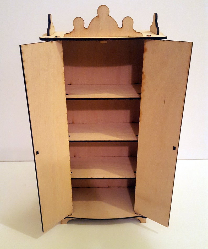 May include: A wooden dollhouse cabinet with two doors and four shelves. The doors are open and the cabinet is empty.