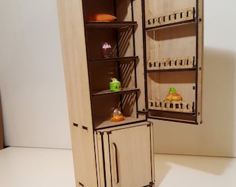 May include: A miniature wooden refrigerator with a door that opens. The refrigerator has shelves inside and is filled with small toy food items. The refrigerator is made of light brown wood and has a dark brown handle.