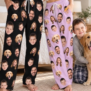 May include: Two pairs of lounge pants featuring a repeating pattern of printed faces of a man, a boy, and a golden retriever dog. One pair is black and the other is light purple, both with white drawstring waistbands and elastic cuffs.