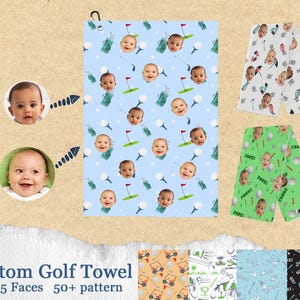 May include: Custom golf towel featuring a repeating pattern of baby faces, golf balls, flags, and golf clubs on a light blue background. The towel has a black hanging loop. The text "Custom Golf Towel" is at the bottom.
