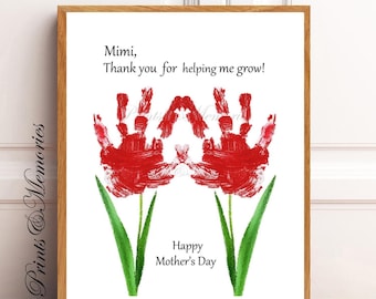 May include: A framed print with a handprint art design of two red tulips with green stems. The text reads "Mimi, Thank you for helping me grow! Happy Mother's Day."