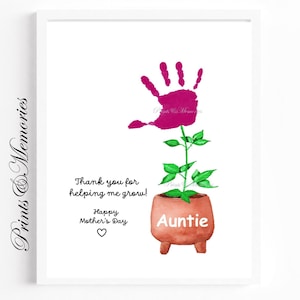 May include: A pink handprint in the shape of a flower growing out of a pot with the word "Auntie" on it. The text below reads "Thank you for helping me grow! Happy Mother's Day".