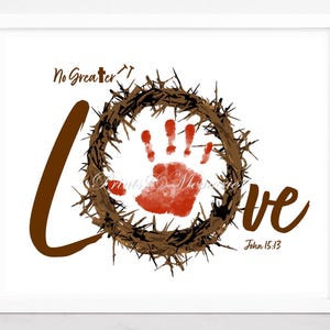 May include: A brown and white print with the words "No Greater Love" and a red handprint inside a brown thorn crown. The text "John 15:13" is below the crown.