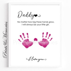 May include: A framed print with the word "Daddy" and a heart symbol at the top. Below, it reads "No matter how big these hands grow, I will always be your little girl." Pink handprints are featured, with "I love you" at the bottom.