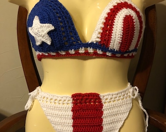 May include: A crocheted bikini top and bottom in red, white, and blue with a star design. The top is a triangle style with adjustable straps. The bottom is a high-waisted style with ties on the sides.