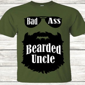 May include: A green t-shirt with a black silhouette of a beard and sunglasses. The text "Bad Ass Bearded Uncle" is printed in white on the shirt.